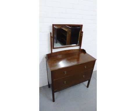 An Art Deco oak dressing table with two long drawers to the base 