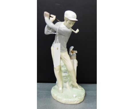 A Lladro porcelain figure of a Golfer in full swing, 29cm high