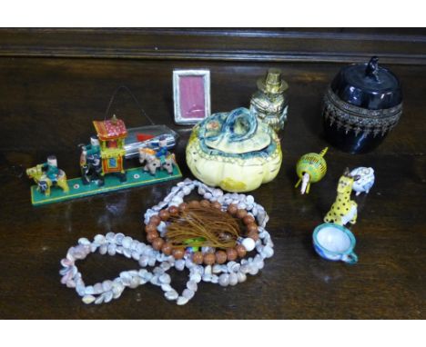 A mixed lot to include a brass inkwell, Epns purse, small silver photo frame, French pottery dish and cover, black glazed tob