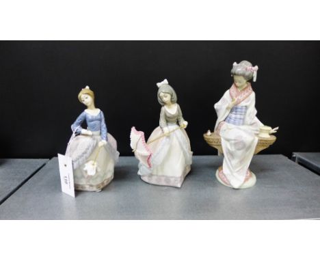 Three Lladro porcelain figures to include a Geisha girl (a/f), together with two smaller models of girls with parasols, talle