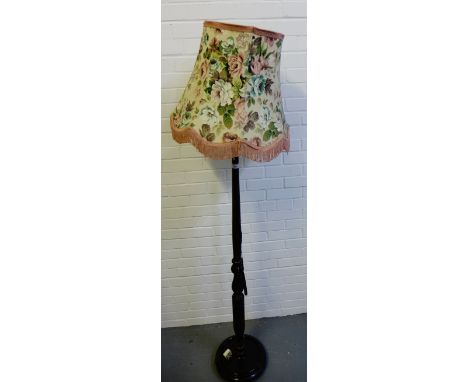 A mahogany standard lamp and shade 