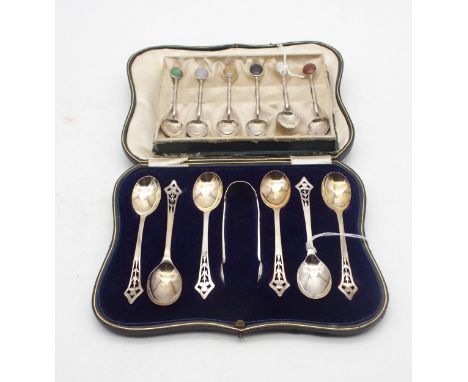 A&nbsp; cased set of silver tea spoons and sugar tongs, the terminals with pierced Art Nouveau decoration,&nbsp;Brook &amp; S