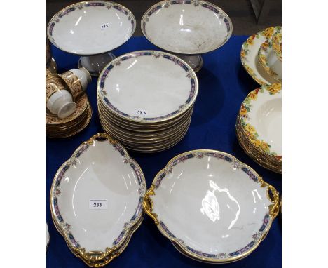 A Bernardaud &amp; Co, Limoges dessert service comprising two tazzas, eleven plates, two round dishes and two oval dishes Con