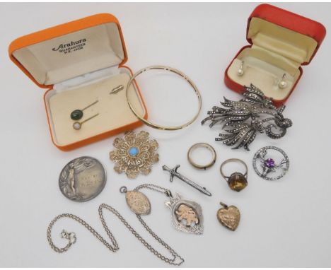 Two silver chess medallions, a yellow metal heart shaped locket, a large marcasite brooch and other items Condition Report:No