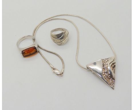A Norwegian silver pendant, signed Aha, designed by Astri Holthe, together with a silver ring signed Coro, and a silver amber