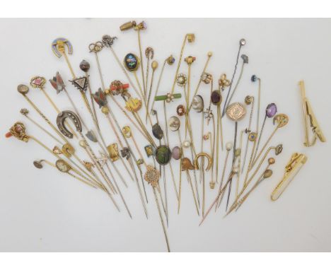 A large collection of vintage lapel pins to include items by FIX, jewel beetles, silver topped Scottish agate, gem set and ye