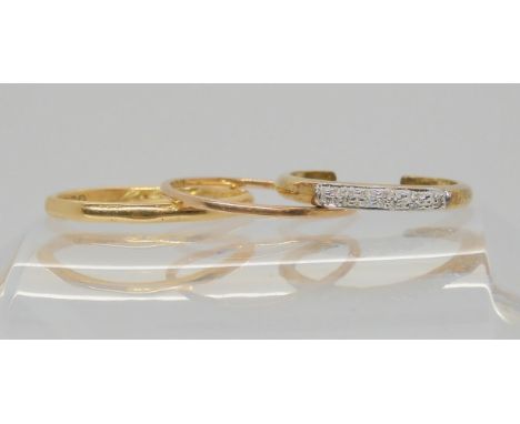 An 18ct gold wedding ring size M1/2, weight 1.4gms, a 9ct gold wedding ring and a diamond set toe ring, weight together 1.6gm