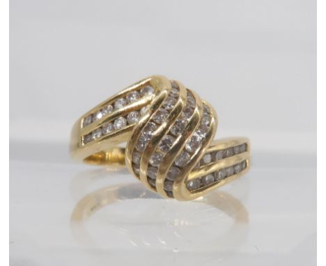 An 18ct gold diamond set twist ring, set with estimated approx 0.40cts of brilliant cut diamonds, size M, weight 5.3gms Condi