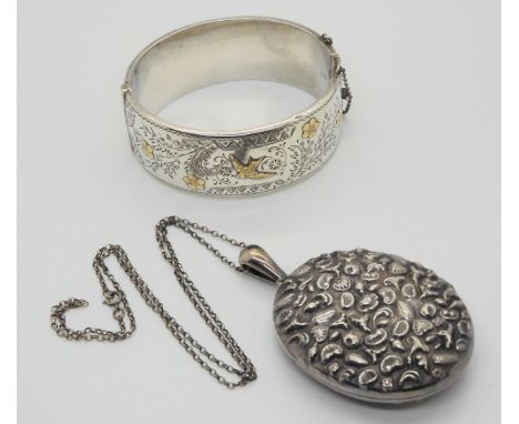 A silver and yellow metal swallow bangle with Birmingham hallmarks for 1953, made by Deakin &amp; Francis (wax filled) togeth