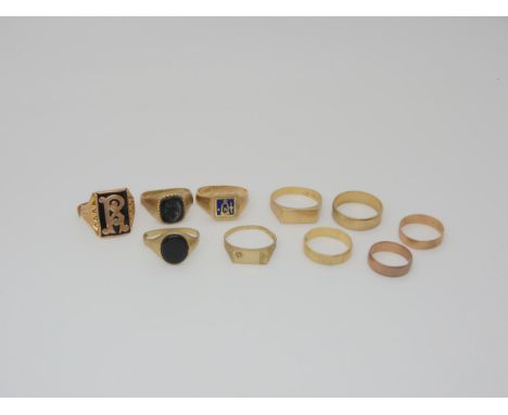 Four 9ct gold wedding bands, a swivel masonic ring, and five other rings,&nbsp;weight together 34.9gms Condition Report:Avail
