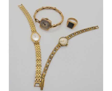 A gent's 9ct bloodstone signet ring, 5.8gms, a 9ct watch head on plated strap and two gold plated wristwatches Condition Repo