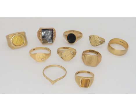 A 9ct wedding band, an onyx set signet ring, and eight other 9ct gold rings,&nbsp;weigh together 40.9gms Condition Report:Ava