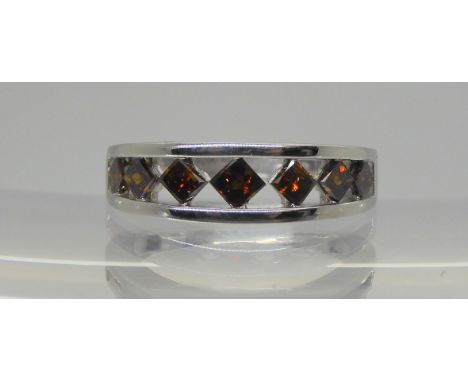 A 9ct gold red diamond seven stone ring, set with estimated approx 0.60cts of step cut diamonds, size J1/2, weight 2.7gms Con