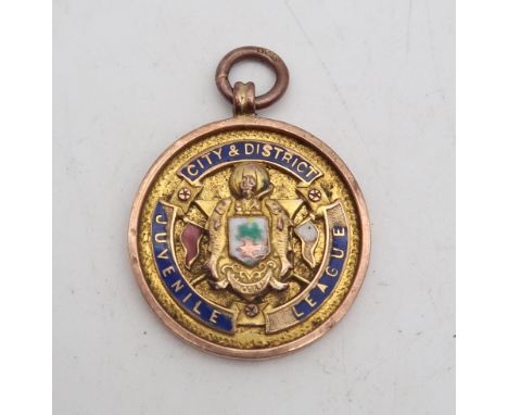 A 9ct gold football medal for the Glasgow &amp; District Juvenile League, engraved verso "Championship won by St. Mungo F.C.,