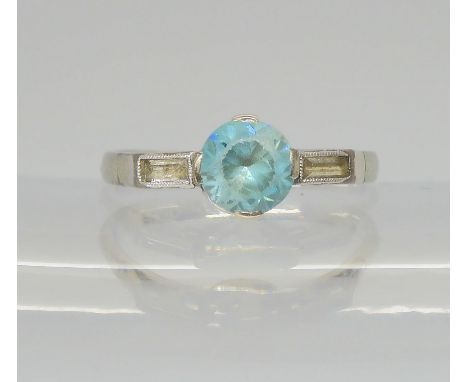 A platinum and 18ct white gold blue zircon and clear gem set ring, size N, (shank split) weight 2.3gms Condition Report:Avail