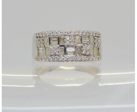 An 18ct white gold ring set with baguette and brilliant cut diamonds, size M Condition Report:Available upon request