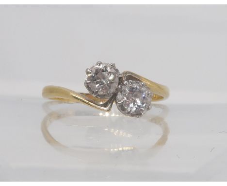 A vintage 18ct and platinum twin stone diamond ring, set with estimated approx 0.40cts of old cut diamonds, finger size O1/2,