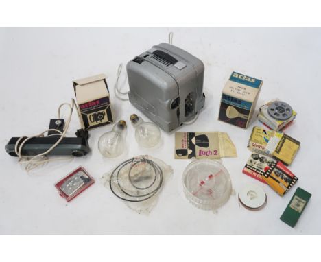 A Soviet Luch-2 movie projector, in original packaging and with a range of accessories; a photographic lamp etc. Condition Re