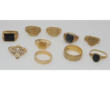 Two 9ct gold wedding bands, a hematite centurion signet ring, two onyx set rings, and five other 9ct rings Condition Report:A