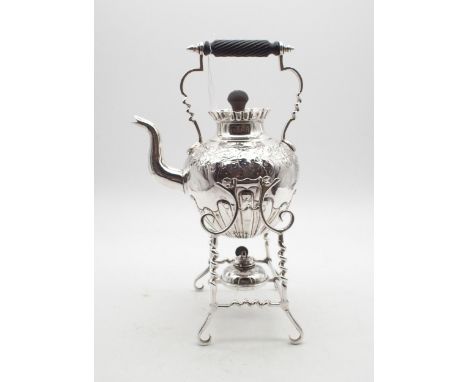 An EPNS spirit kettle and stand, of globular form, with embossed scrolling foliate decoration and a turned wooden handle and 