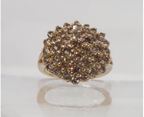 A 9ct yellow gold champagne diamond cluster ring, set with estimated approx 1.50cts of brilliant cut diamonds, finger size K,
