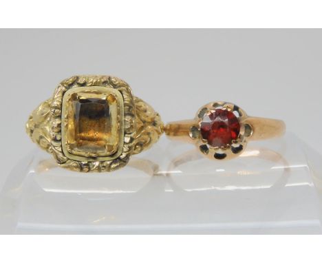 A Georgian gem set rolled gold ring,size N1/2,&nbsp; together with a 9ct gold garnet ring, size P1/2, weight 2.1gms Condition