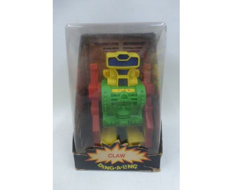 A boxed Claw Robot, made in Hong Kong. 