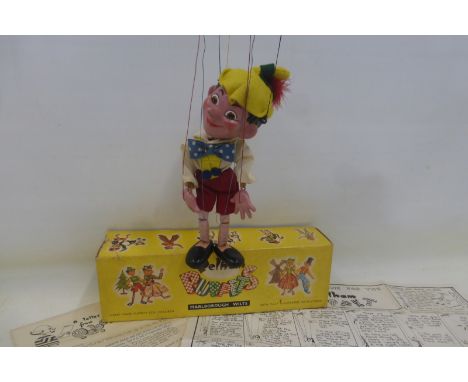 An early 1960s 'Pinocchio' Pelham Puppet with moulded feet, in excellent condition, with instructions and feather still intac