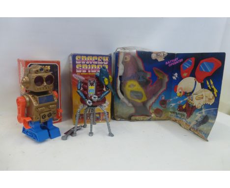 A boxed Space Monster robot, made in Hong Kong, a Spacey Spider by Talbot Toys, boxed and a battery operated Universe Fightin