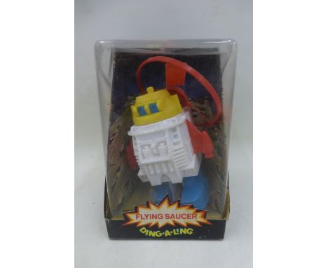A boxed Flying Saucer robot, made in Hong Kong.