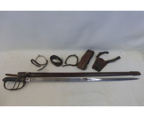 A WWI Royal Artillery sword in a leather scabbard, with Sam Browne belt, holster and spurs, by repute owned by Major Alan Fil