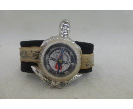 A Space Cadets wrist mounted compass. 