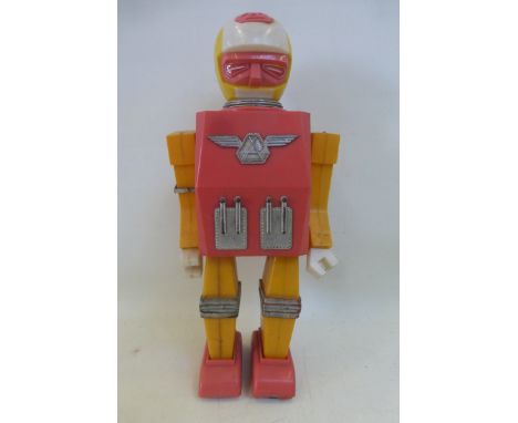 A plastic Mr. Astronaut robot, made in Hong Kong.