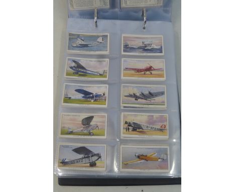 An album of cigarette cards including Carreras 'History of Army Uniforms', Longleat House, etc.