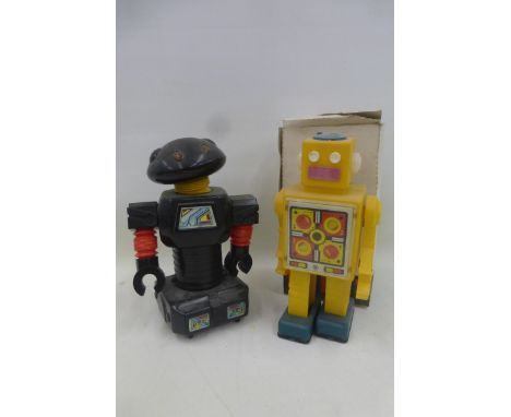 A boxed Russian robot and a Chinese robot. 