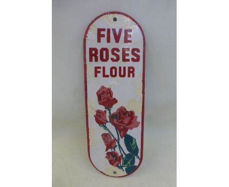 A Five Roses Flour pictorial enamel door finger plate, decorated with flowers, older retouching, 4 x 11 1/2".