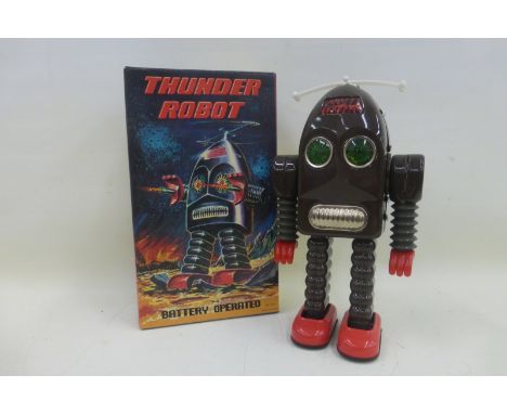 A contemporary Chinese tinplate battery operated Thunder robot. 