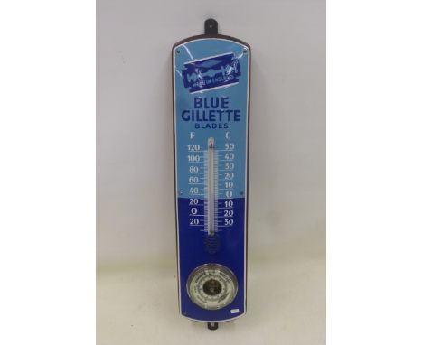 A Blue Gilette Blades two tone blue enamel thermometer and barometer combined, 6 x 25".