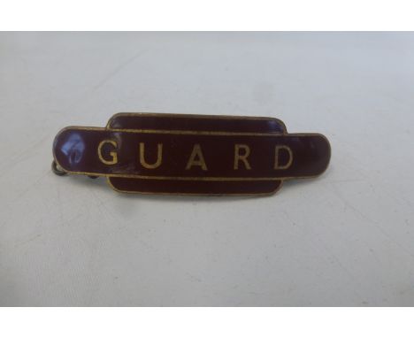A Western Region 'Guard' totem curved enamel cap badge.