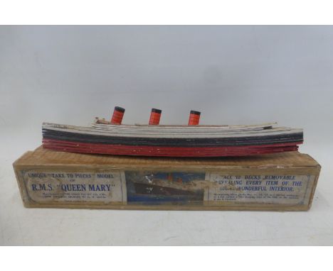 A boxed Chad Valley 'take to pieces' model of R.M.S. 'Queen Mary'.