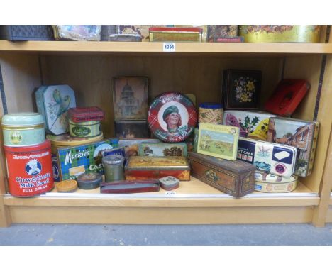 A shelf full of assorted tins.