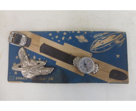 A Space Navigator wrist mounted compass, still on the original card, made in Japan. 