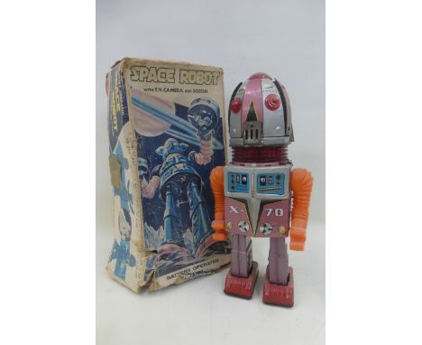 A boxed 1960s Japanese tinplate and plastic Space Robot, head splits open revealing a rotating lighted camera, aka 'Tulip Hea