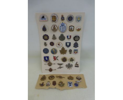 Two cards of mainly enamel badges including 23 sweetheart brooches.