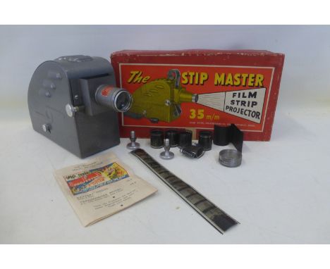 A boxed Stip Master film strip projector.