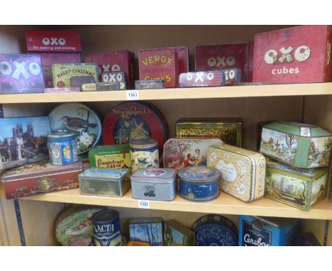 A shelf full of assorted tins including Mackintosh's.