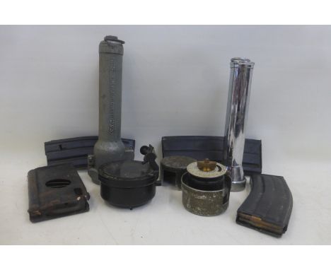 A box of assorted military equipment including a Naval compass, torches and magazines.