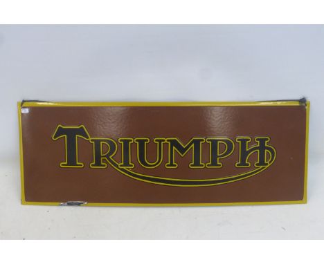A reproduction Triumph rectangular enamel sign, 27 1/2 x 10".