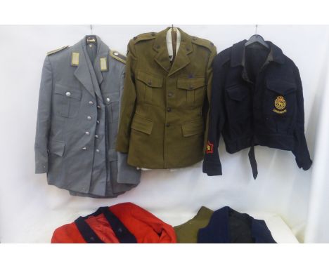 A quantity of military uniforms including Light Infantry and Luftwaffe.