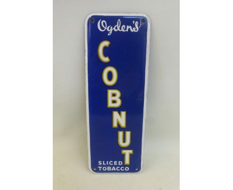 An Ogden's Cobnut Sliced Tobacco enamel finger plate, with a very small professional repair to the enamel, 3 1/4 x 9". 